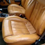 Close-up of Damaged Tan Leather Seat in an Alfa Romeo GTV