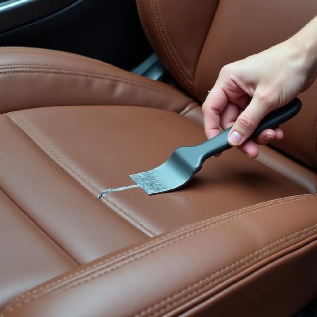 Applying Leather Filler to a Crack in Car Seat