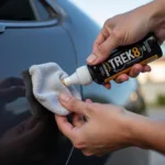 Applying Scratch Remover on Car Scratch