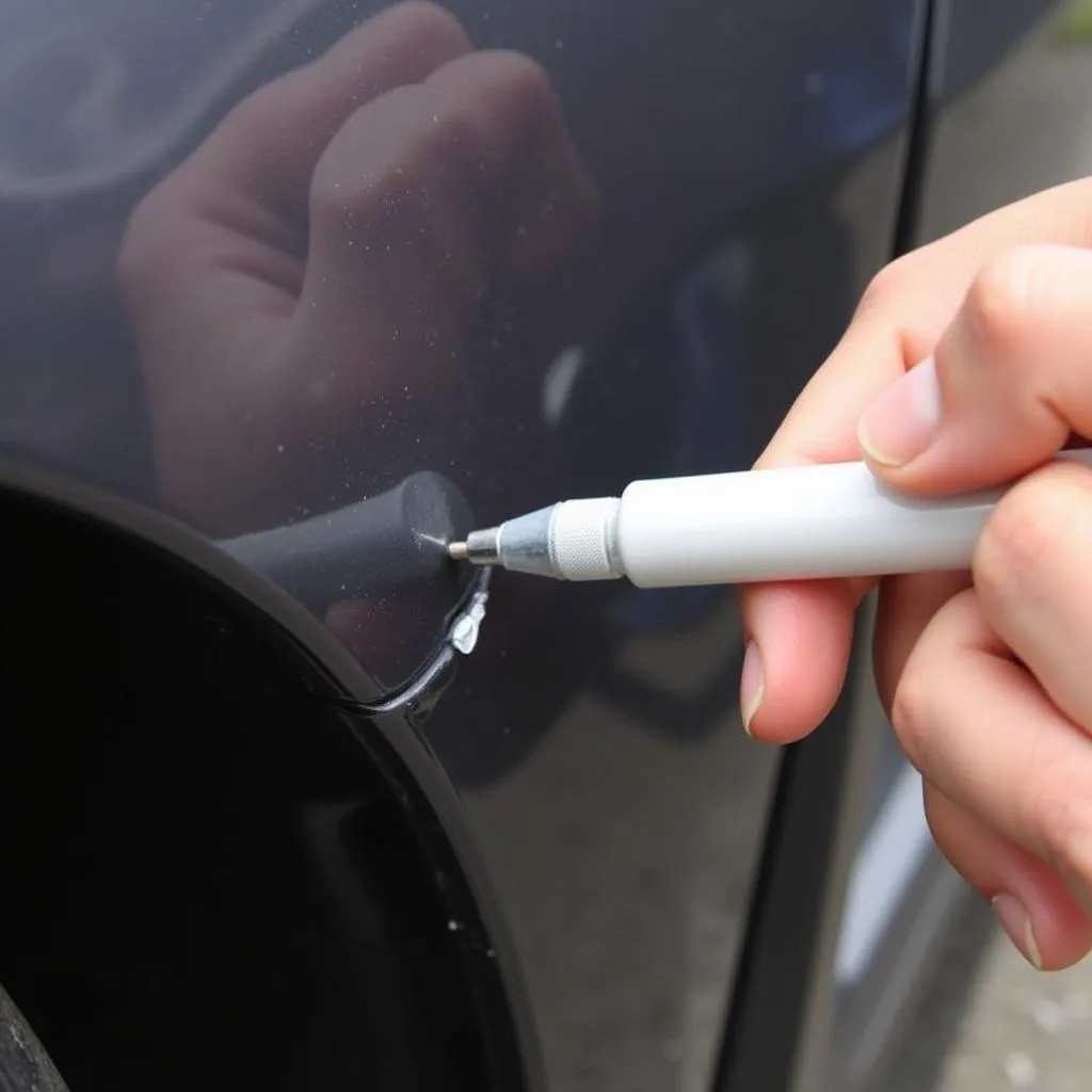 Applying Touch-Up Paint to Car Bumper