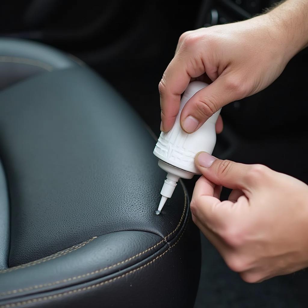 Applying Vinyl Filler to a Car Seat Tear