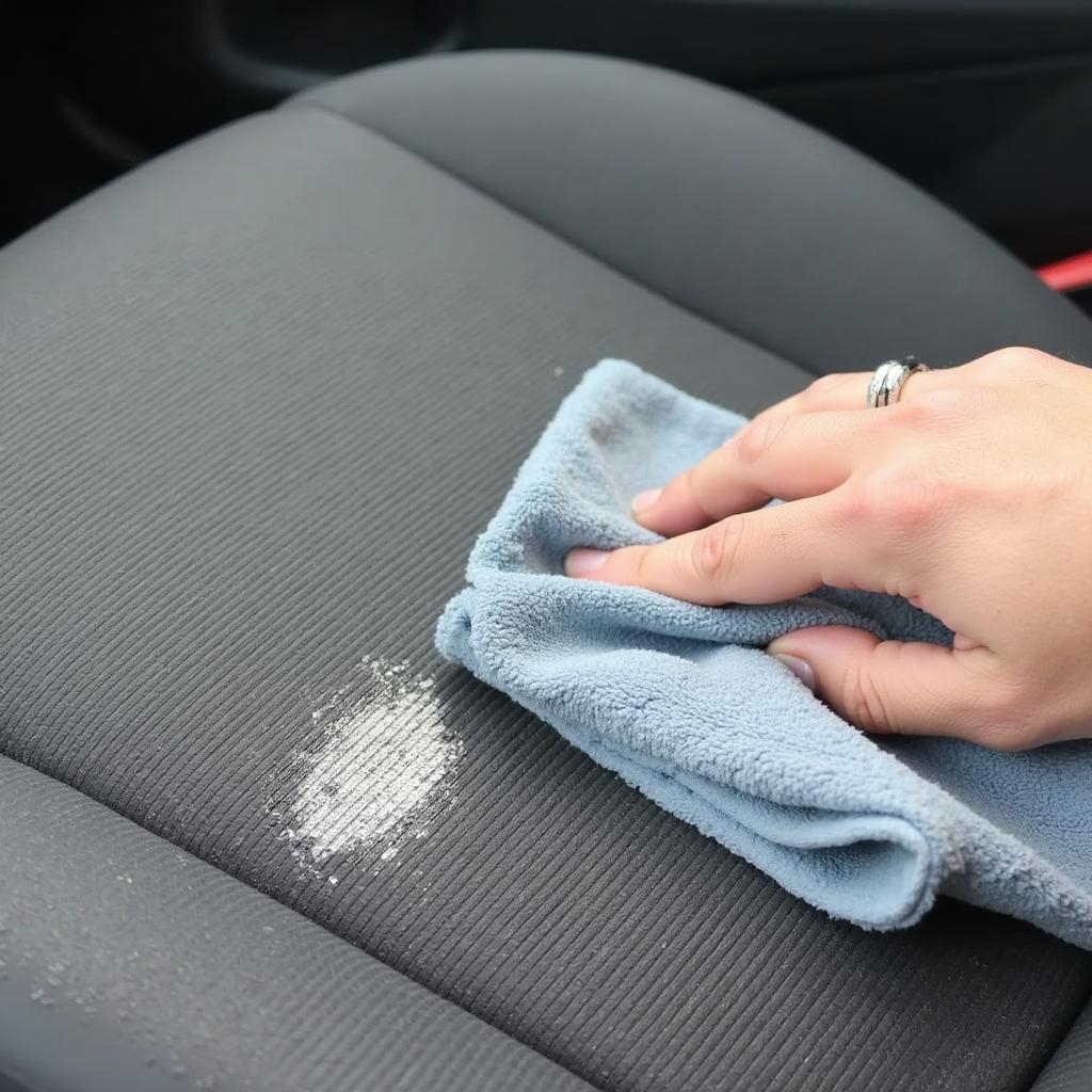 Applying Baking Soda Paste to Cigarette Burn