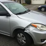 Car with damage from a collision in Beechmont, OH