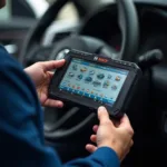 Skilled Technician Using Advanced Diagnostic Tools at Bosch Car Service in MacArthur