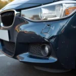 Close-up of damaged car bumper