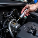 Mechanic inspecting car air conditioning system in Maidstone