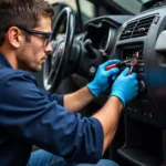 Technician Inspecting Car AC System