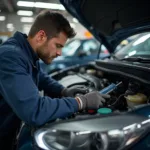 Mechanic inspecting car AC system in Toronto