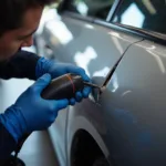 Car body repair in Watford, showcasing dent removal process