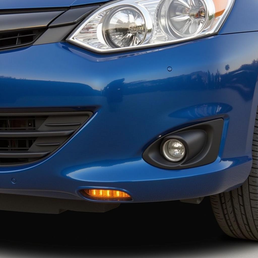 A car bumper protected by parking sensors to prevent scratches.