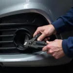 Close-up of a car bumper being repaired in Gwynedd