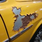 Close-up of car paint chip damage