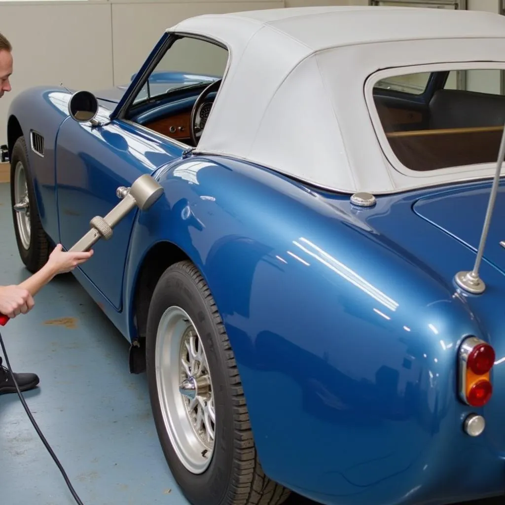 Close-up of the car paint color matching process using a digital spectrophotometer