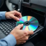 Car Repair Software CD on Laptop