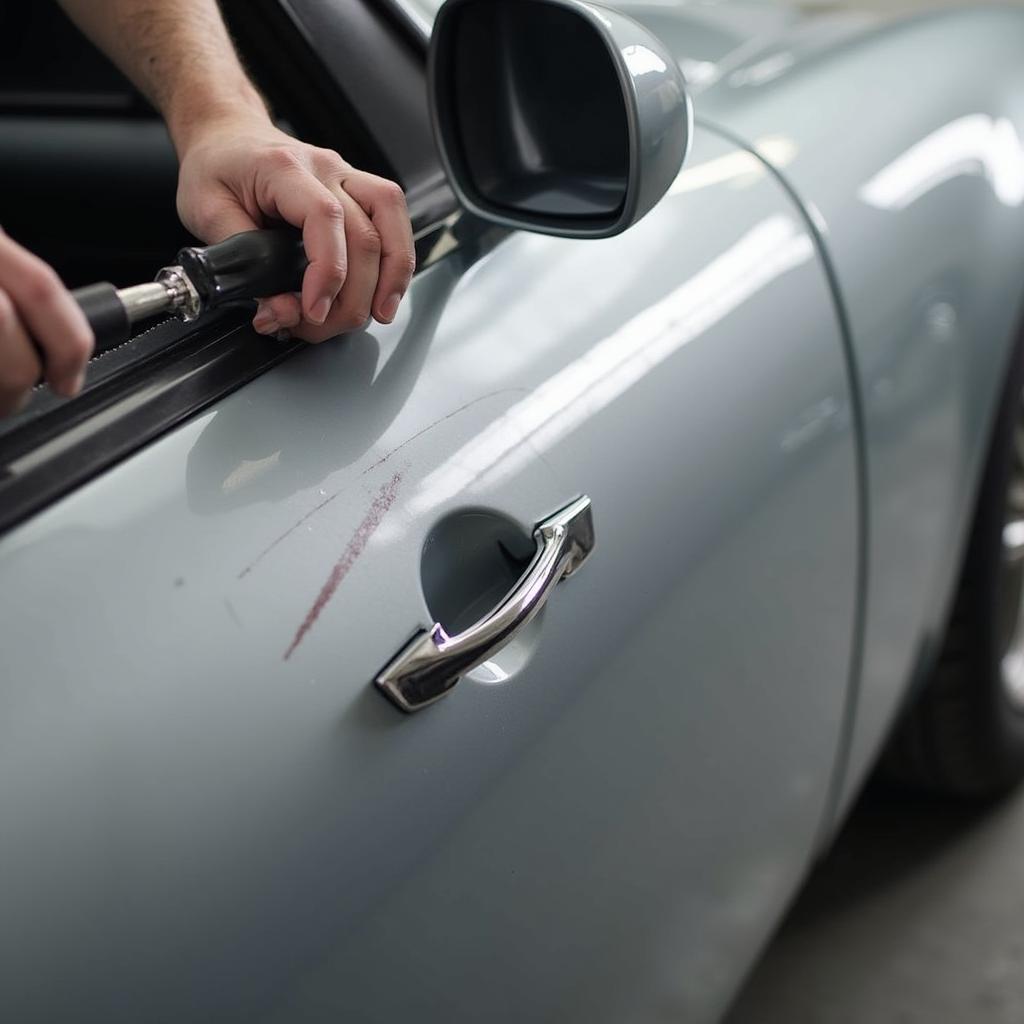  Repairing scratches on a car door in a Whitstable body shop