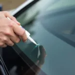 Applying a car window crack repair kit