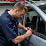 Skilled Technician Repairing Car Window in Benton, AR