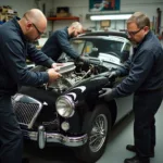 Skilled Mechanics Restoring a Vintage Vehicle