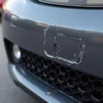 Close-up of damaged car bumper