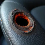 Deep Burn Hole in Car Seat