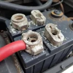 Close-up of corroded car battery terminals in a Middlesbrough garage