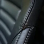 Close-up of a cut in a leather car seat