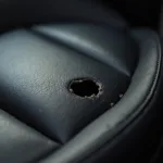 Leather car seat with a hole