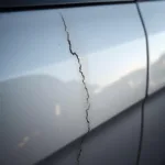 Close-up of a scratch on a Lincoln car paint