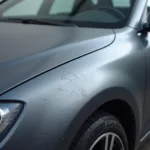 Matte car paint damage close up