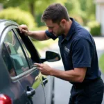 Technician repairing a car window onsite in Harford County