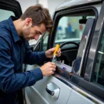 Car window being measured for replacement