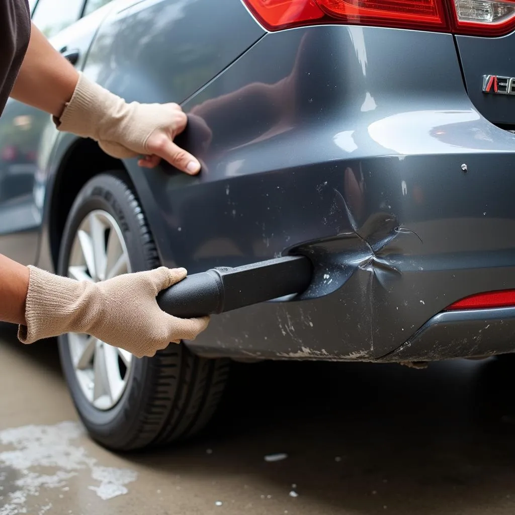 Pushing Out Dent from Behind Car Bumper