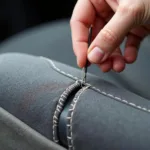 Repairing Cloth Car Seat Seam with Needle and Thread