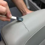 Applying vinyl filler to a cracked car seat