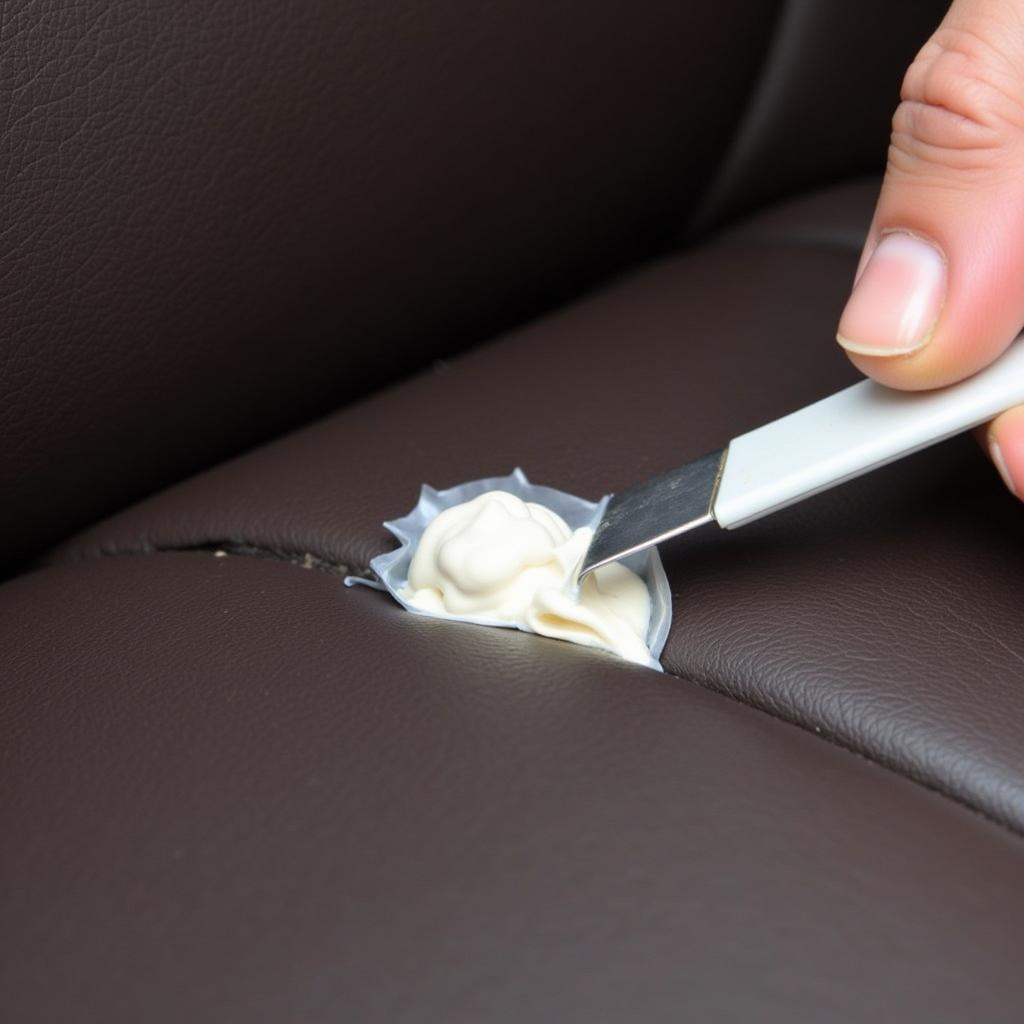 Applying Leather Filler to Car Seat Crack