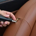 Repairing a rip in a leather car seat