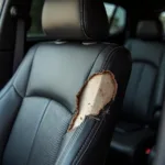 Ripped Leather Car Seat in a GMC Acadia