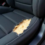 Image of a ripped leather car seat