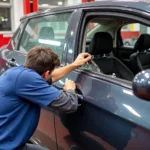 Replacing a car's side window in a Norristown, PA, auto repair shop