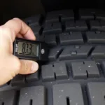 Checking Tire Pressure with Gauge