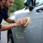 Applying car wax for paint protection