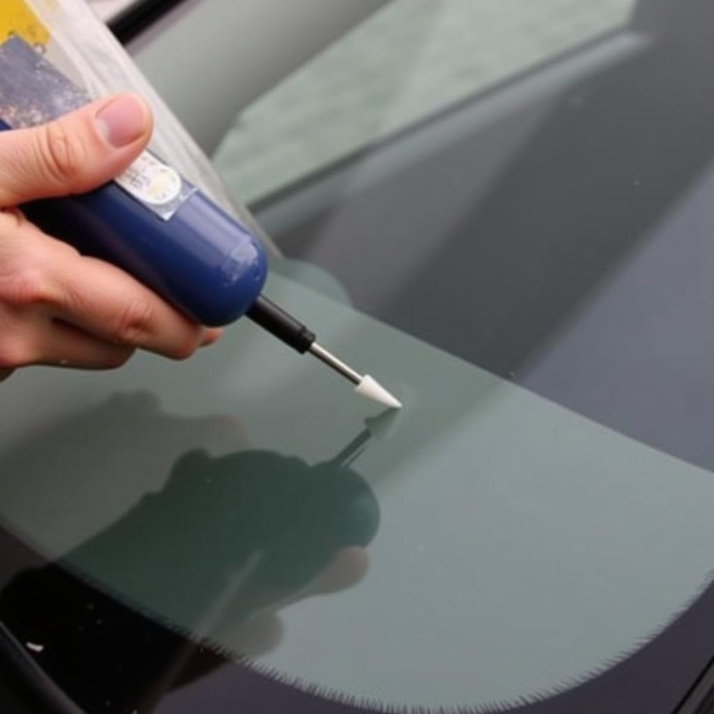 Applying Resin to a Car Window Chip Using a DIY Repair Kit