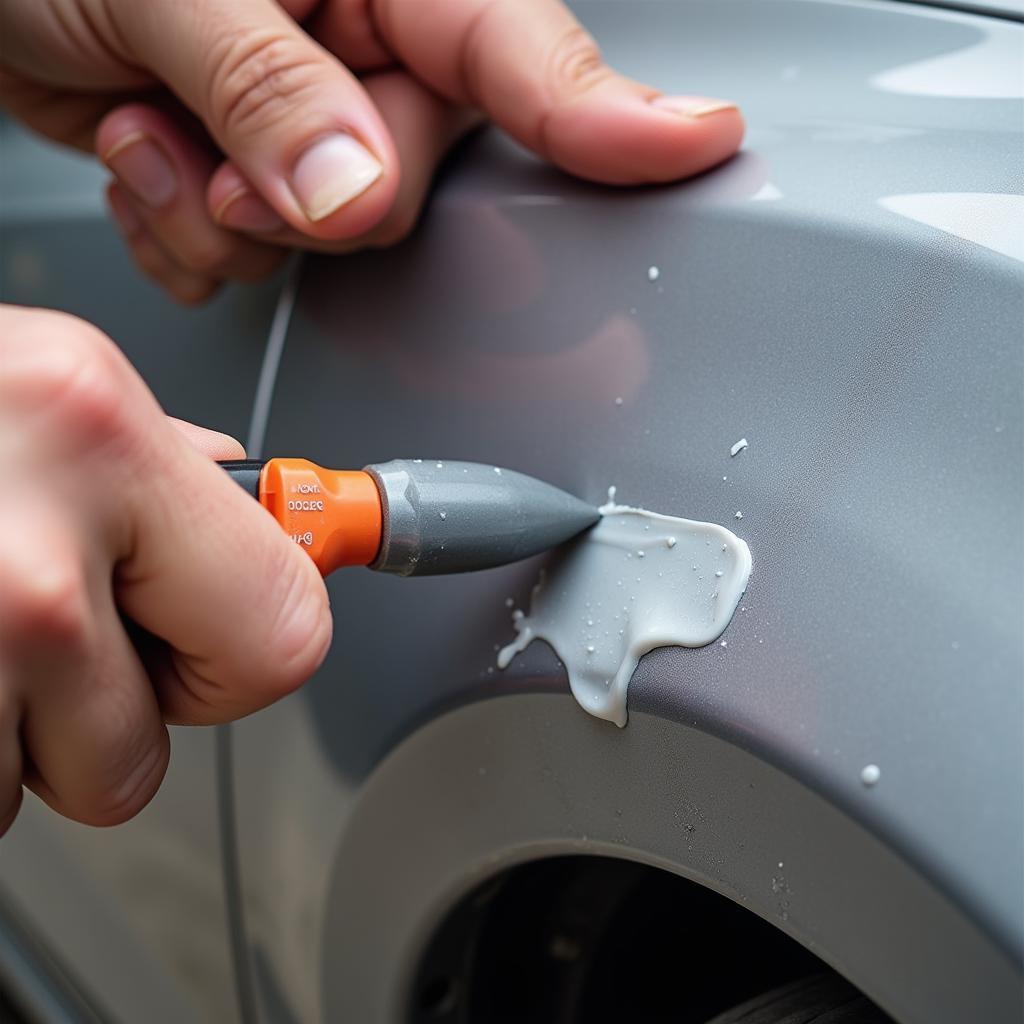 Applying Filler to a Car Bumper Scratch