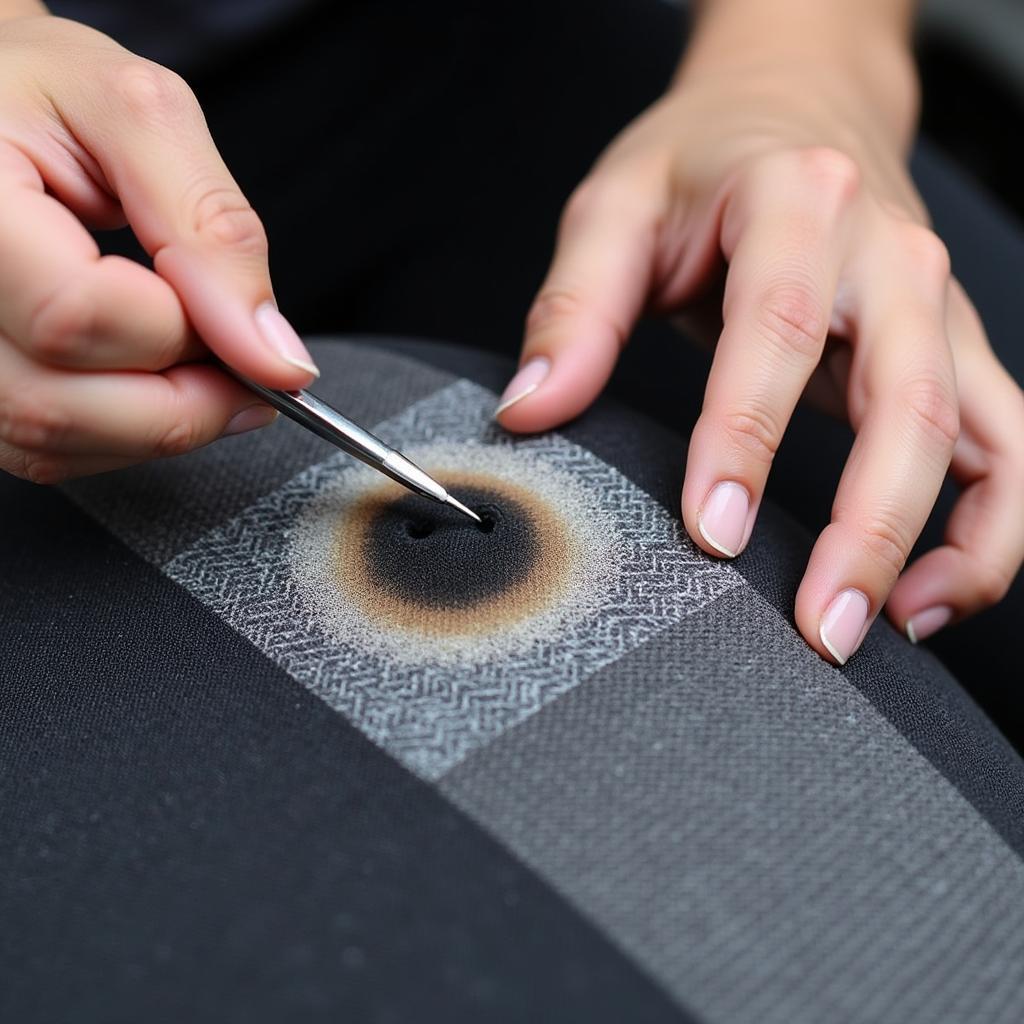 Applying a patch to a burn hole on a car seat