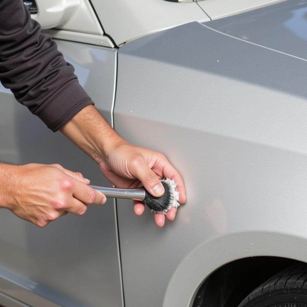 Applying Automotive Primer to Car Door Scratch