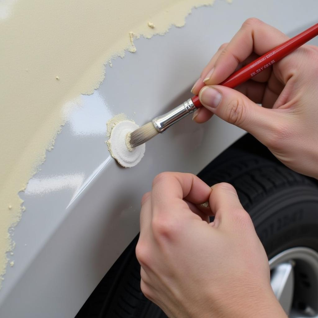 Applying primer to the car paint chip