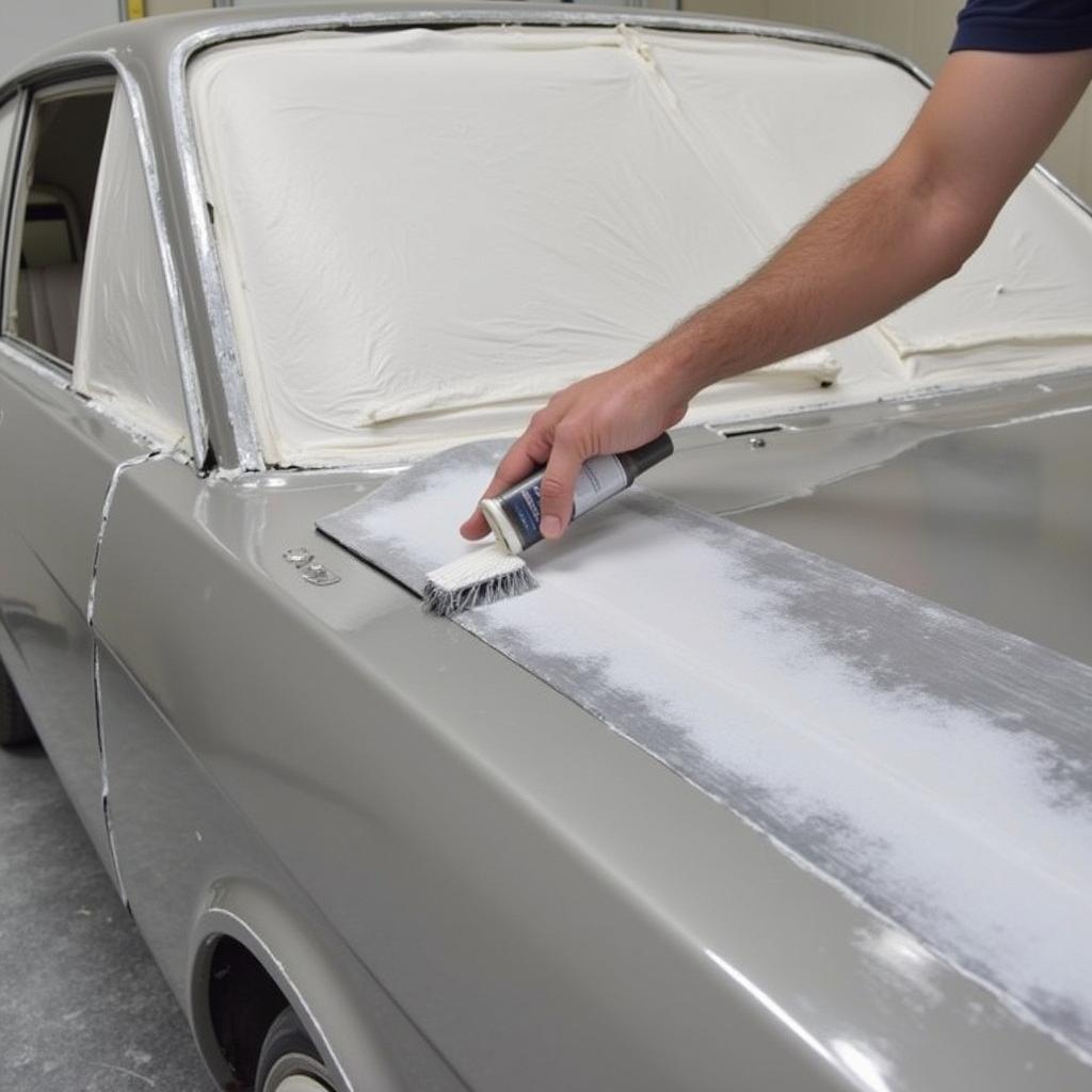 Applying Primer to Car Rust Repair