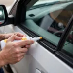 Applying Rubber Seal Adhesive to Car Window Seal