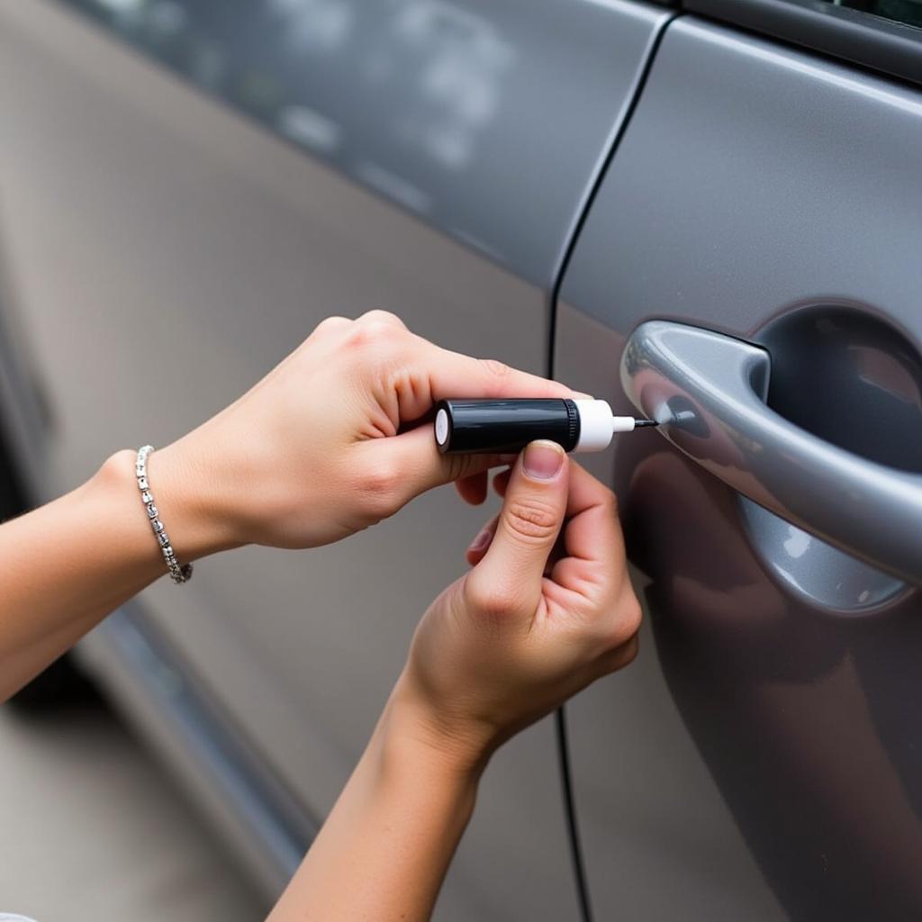 Applying touch-up paint to a car chip