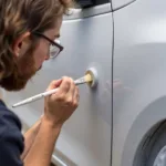 Applying touch-up paint to a car's spot repair